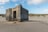 Alter Betonbunker in sandiger Dünenlandschaft.