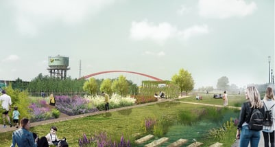 Menschen spazieren in einem Park mit Blumen und Bäumen, im Hintergrund ein Wasserturm und eine Brücke.